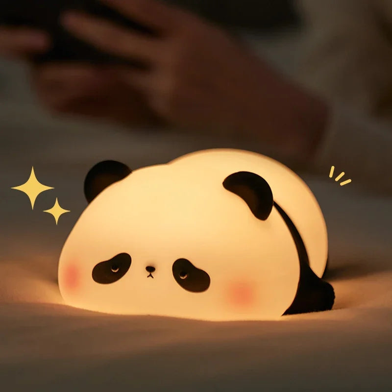 Cute panda-shaped night light on a dark background