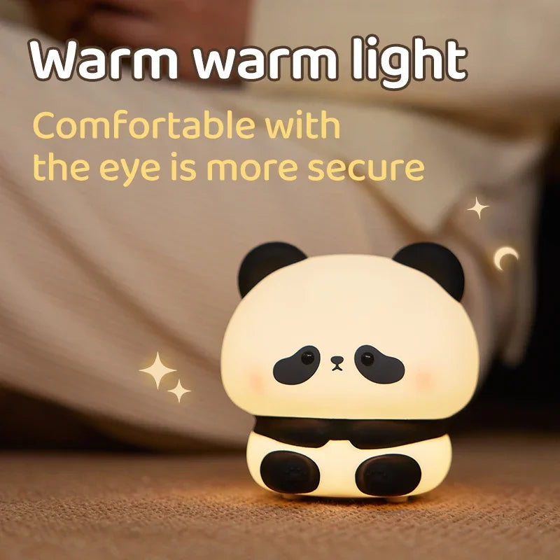 Cute panda night light with text 'Warm warm light Comfortable with the eye is more secure' on a soft background.