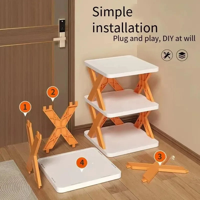 Set of orange and white 5 layer shoe rack with installation instructions on a wooden floor.