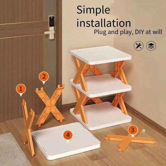 Set of orange and white 5 layer shoe rack with installation instructions on a wooden floor.
