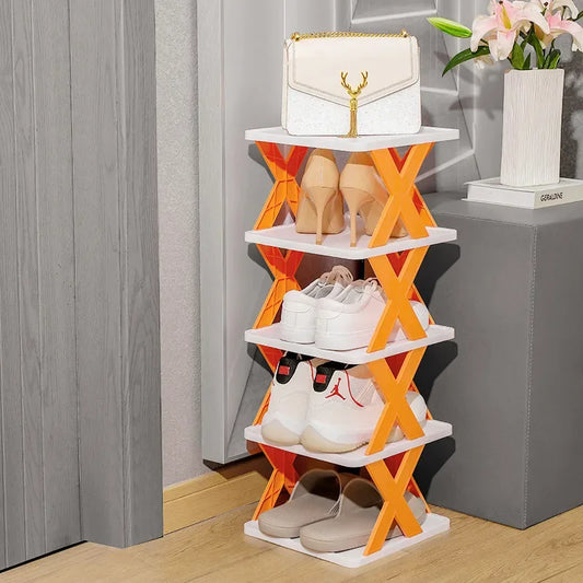 Shoe rack with various shoes on a wooden floor.