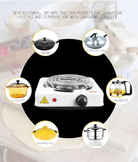 Electric stove hot plate with various cookware items around it on a blurred background