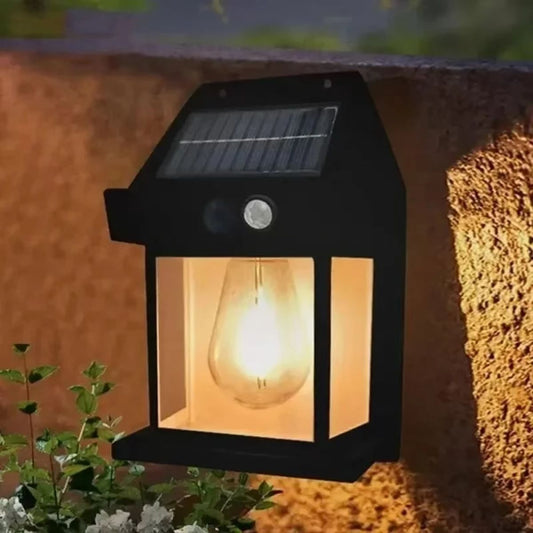 Solar wall lam - outdoor light fixture on a wall with a warm glow