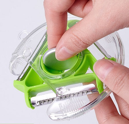 Interchangeable blade rotary peeler slicing vegetables
