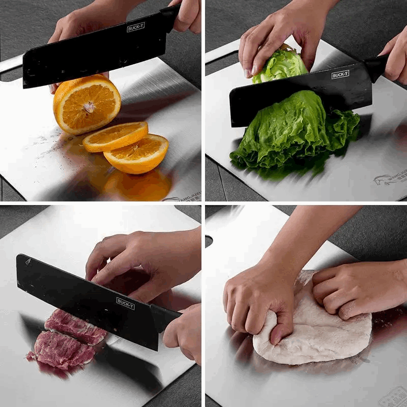 Knife being used to cut an orange, lettuce, meat, and dough on a steel cutting board.
